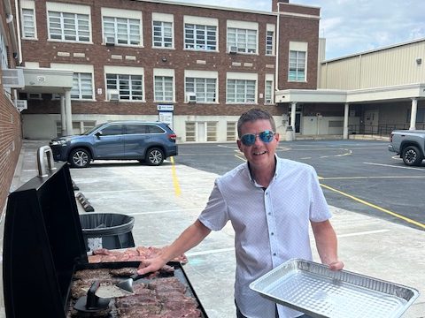 Working the grill before dinner